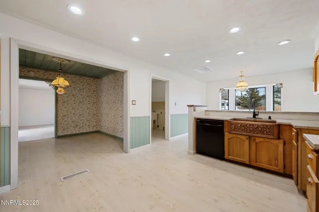 a kitchen with stainless steel appliances a refrigerator and a stove top oven