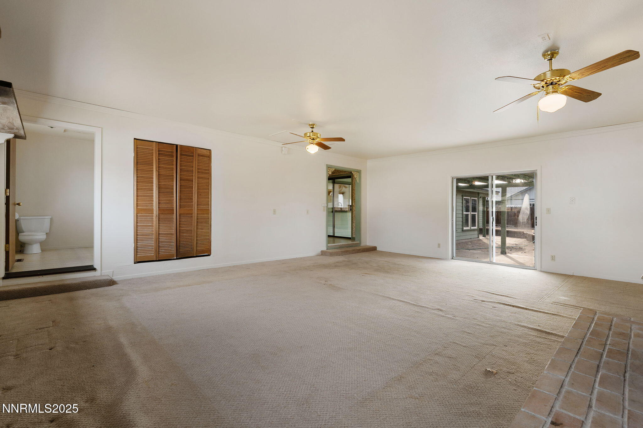 450 Marsh Road Carson City, NV 89701 - Photo 24 of 41 a view of a livingroom with a ceiling fan and window