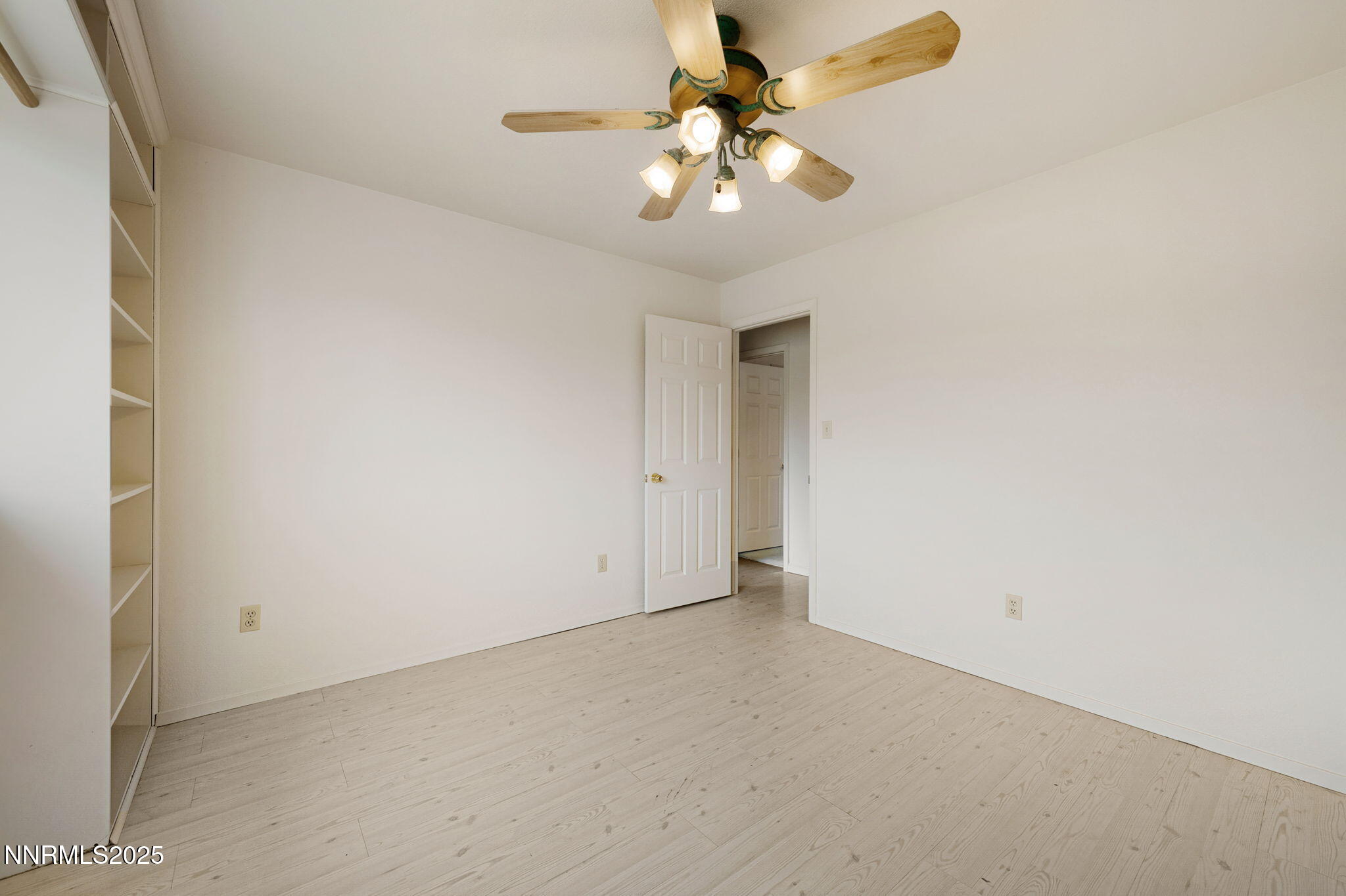 450 Marsh Road Carson City, NV 89701 - Photo 28 of 41 an empty room with a chandelier fan and a window