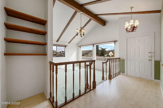 a view of hallway with kitchen