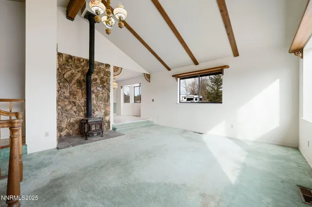 a large kitchen with stainless steel appliances granite countertop a refrigerator and a sink