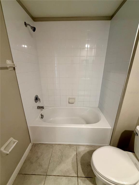 11826 Dumaine Valley Road Riverview, FL 33579 - Photo 24 of 54 a bathroom with a toilet and a bath tub