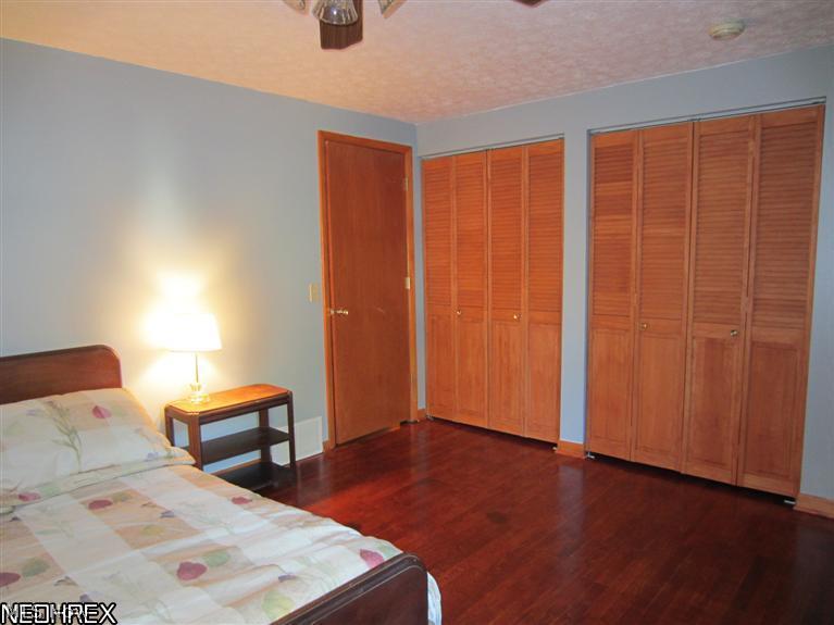 5407 Pleasant Avenue North Ridgeville, OH 44039 - Photo 12 of 17 Master Bedroom with double closets and hardwood floors.