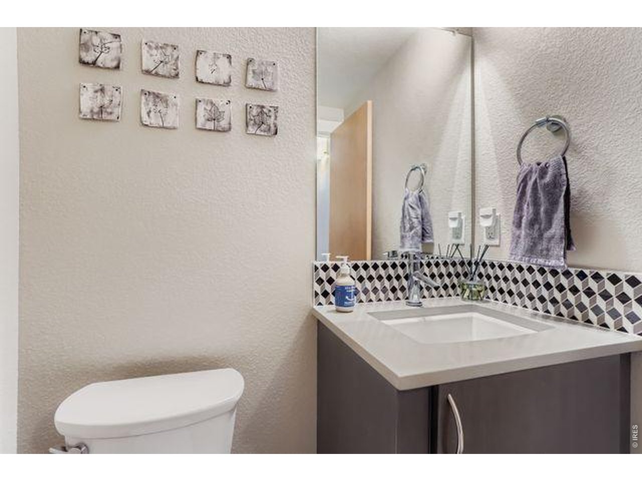 5318 5th Street, Unit D Boulder, CO 80304 - Photo 12 of 30 a bathroom with a sink a toilet and mirror