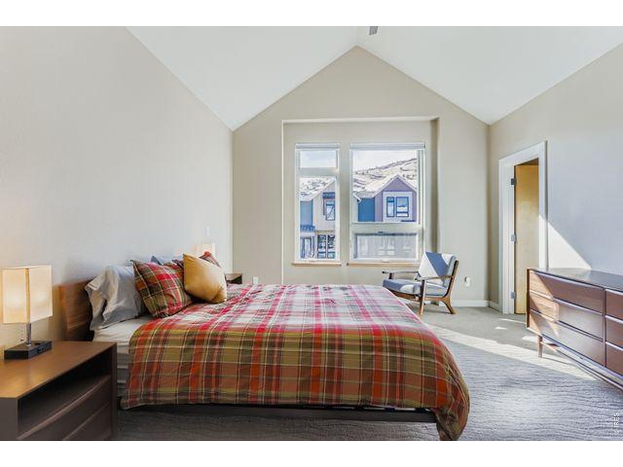 5318 5th Street, Unit D Boulder, CO 80304 - Photo 13 of 30 a bedroom with a bed and wooden floor
