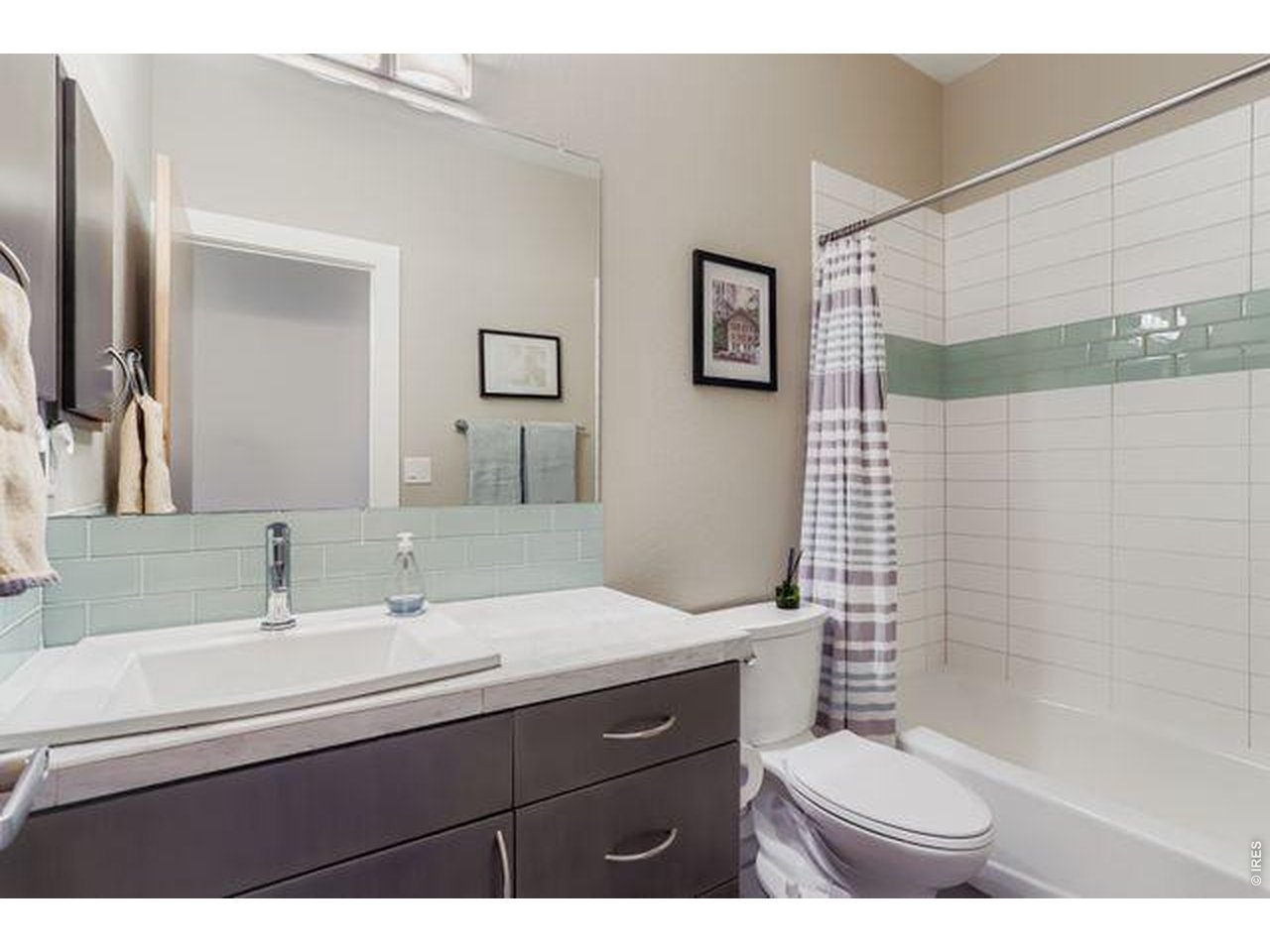 5318 5th Street, Unit D Boulder, CO 80304 - Photo 20 of 30 a bathroom with a sink toilet a mirror and shower