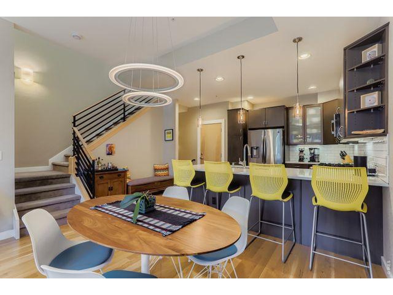 5318 5th Street, Unit D Boulder, CO 80304 - Photo 8 of 30 a dining room with furniture and a chandelier
