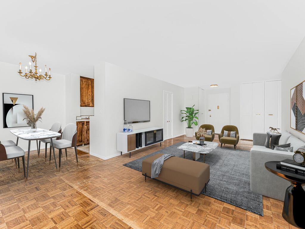 a living room with furniture wooden floor and a flat screen tv