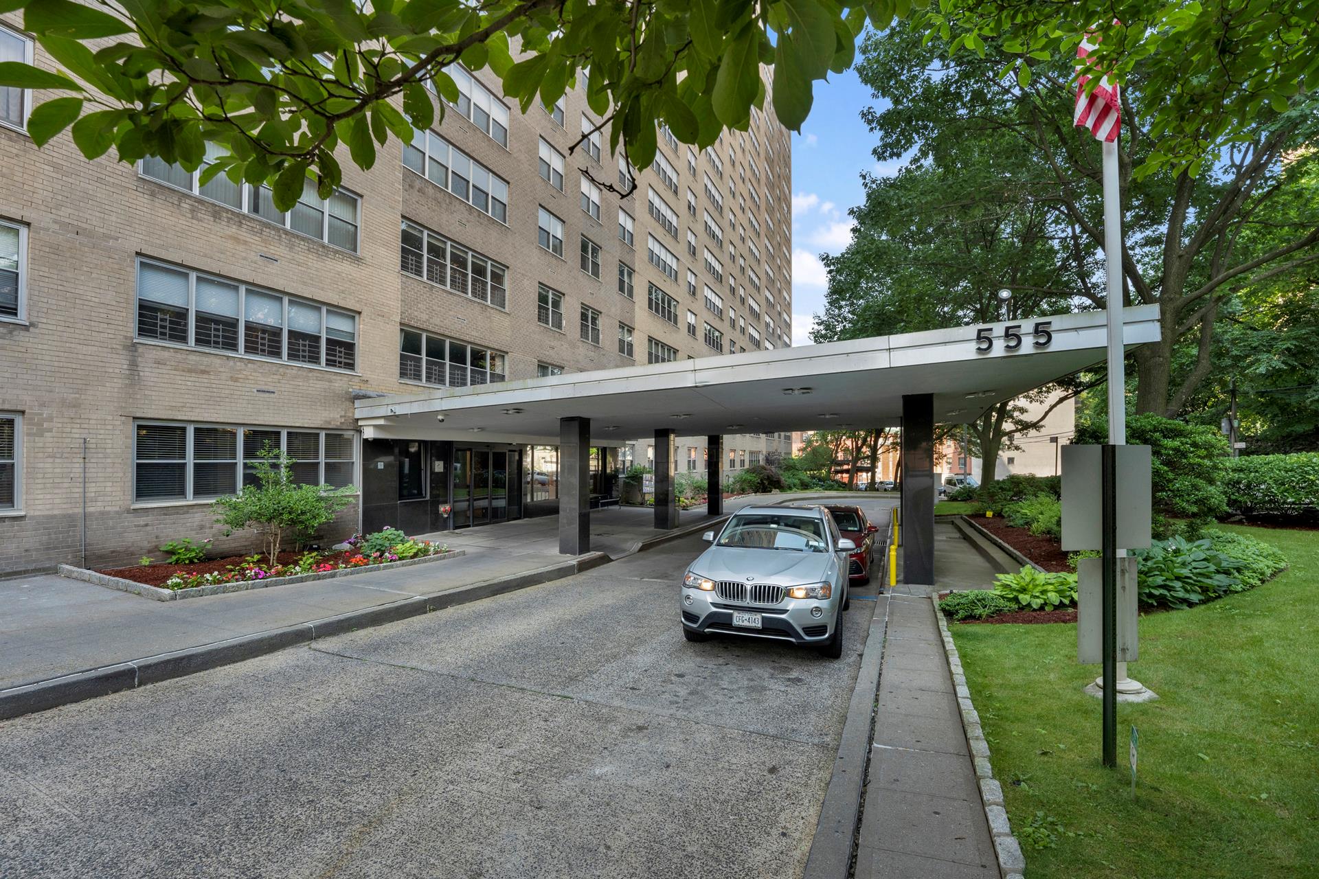 555 Kappock Street, Unit 11B Bronx, NY 10463 - Photo 20 of 29 a car parked in front of a building and cars parked