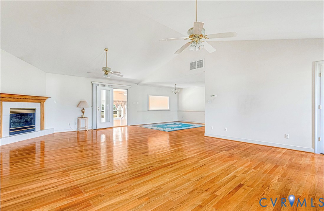 5025 Hurop Road Sandston, VA 23150 - Photo 12 of 57 a view of empty room with wooden floor and fireplace