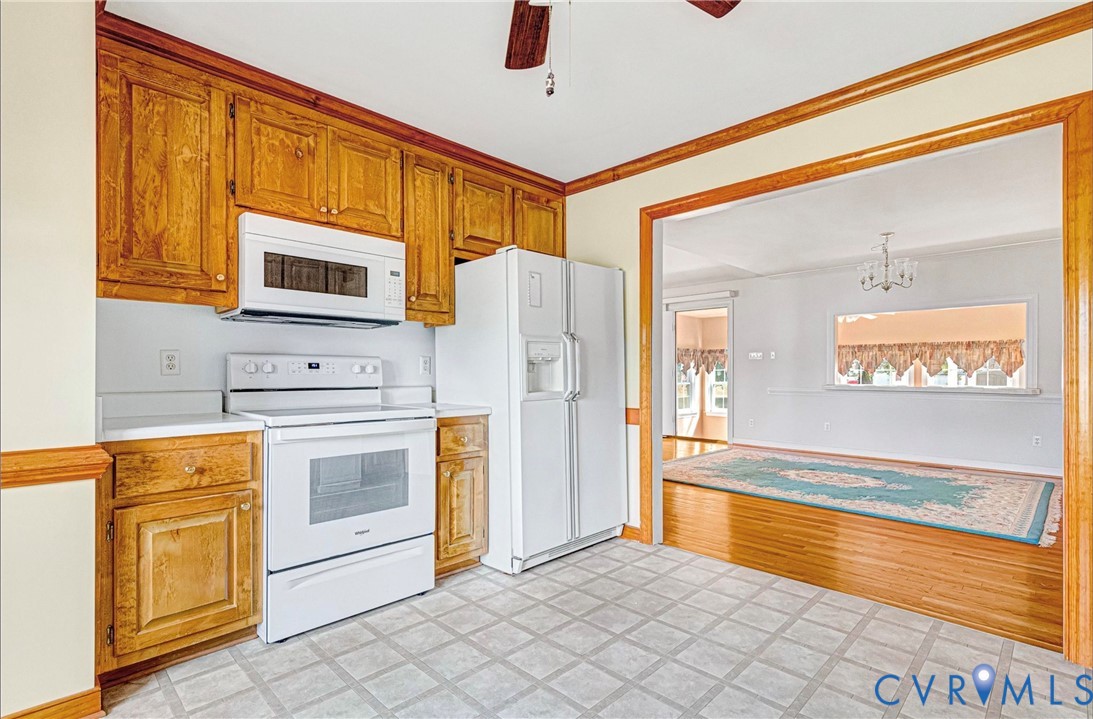 5025 Hurop Road Sandston, VA 23150 - Photo 18 of 57 a kitchen with stainless steel appliances granite countertop a refrigerator and a stove top oven