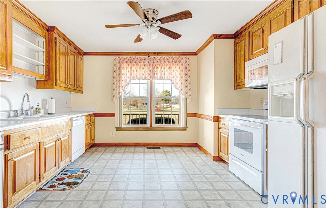 5025 Hurop Road Sandston, VA 23150 - Photo 22 of 57 a kitchen with stainless steel appliances a stove a sink and a refrigerator