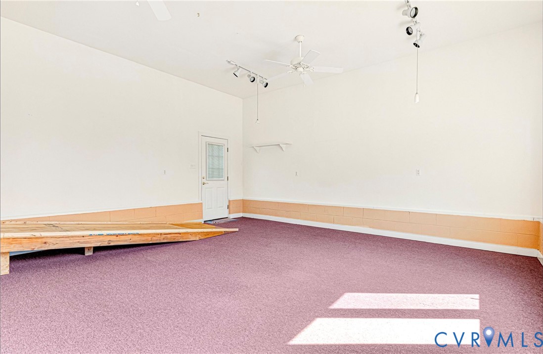 5025 Hurop Road Sandston, VA 23150 - Photo 42 of 57 a view of a room with wooden floor and a ceiling fan