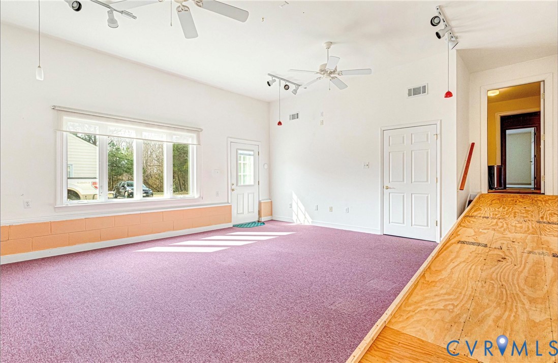5025 Hurop Road Sandston, VA 23150 - Photo 43 of 57 a spacious bedroom with a bed and a large window