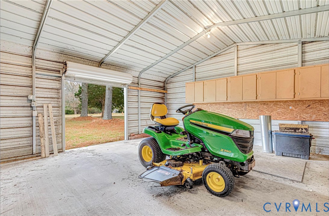 5025 Hurop Road Sandston, VA 23150 - Photo 50 of 57 a car parked in front of garage