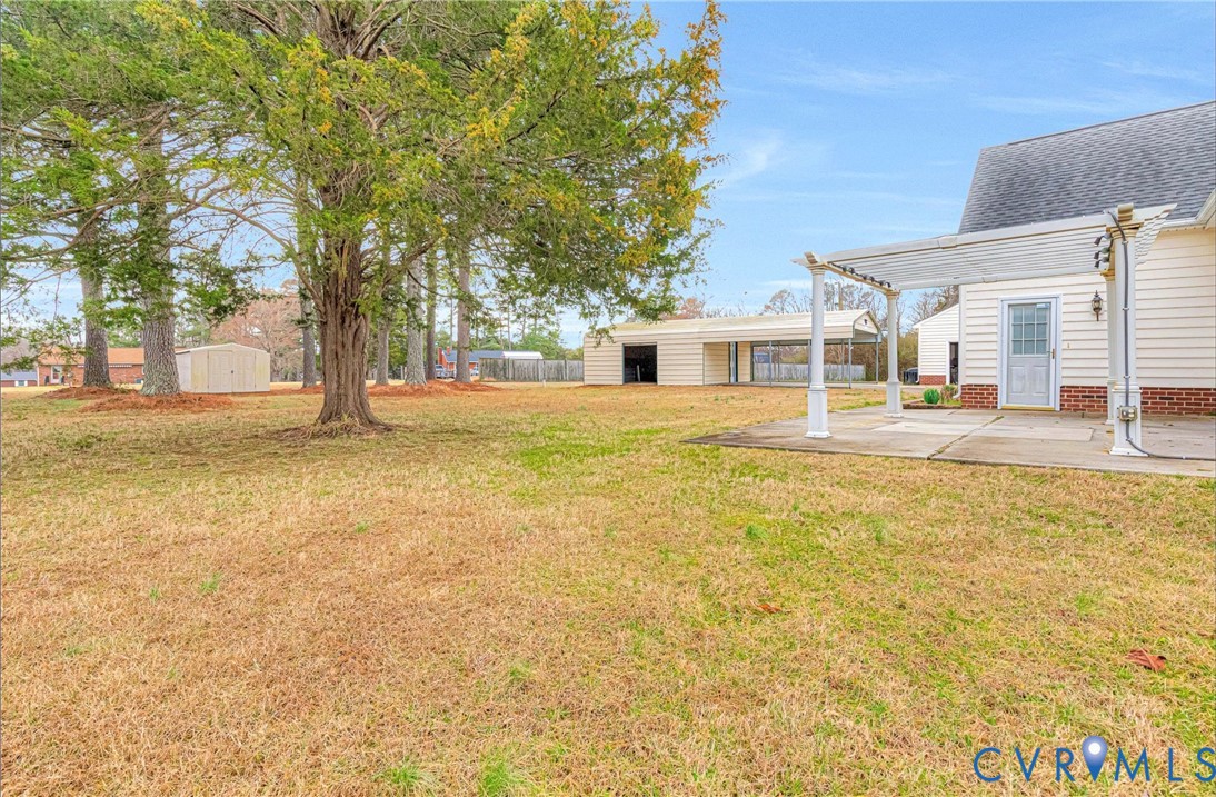 5025 Hurop Road Sandston, VA 23150 - Photo 7 of 57 a view of a yard with a house
