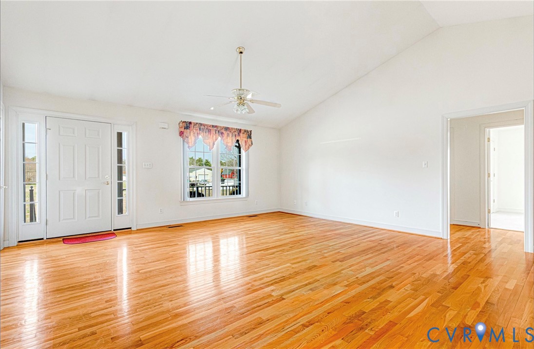 5025 Hurop Road Sandston, VA 23150 - Photo 10 of 57 a view of an empty room with window and wooden floor