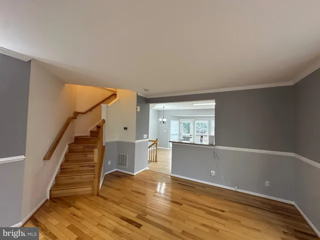 a bathroom with a sink a toilet a mirror and shower