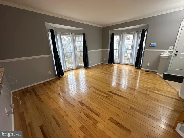 a bathroom with a toilet a sink and a mirror