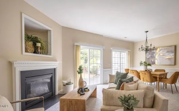 a living room with furniture a window and a fireplace