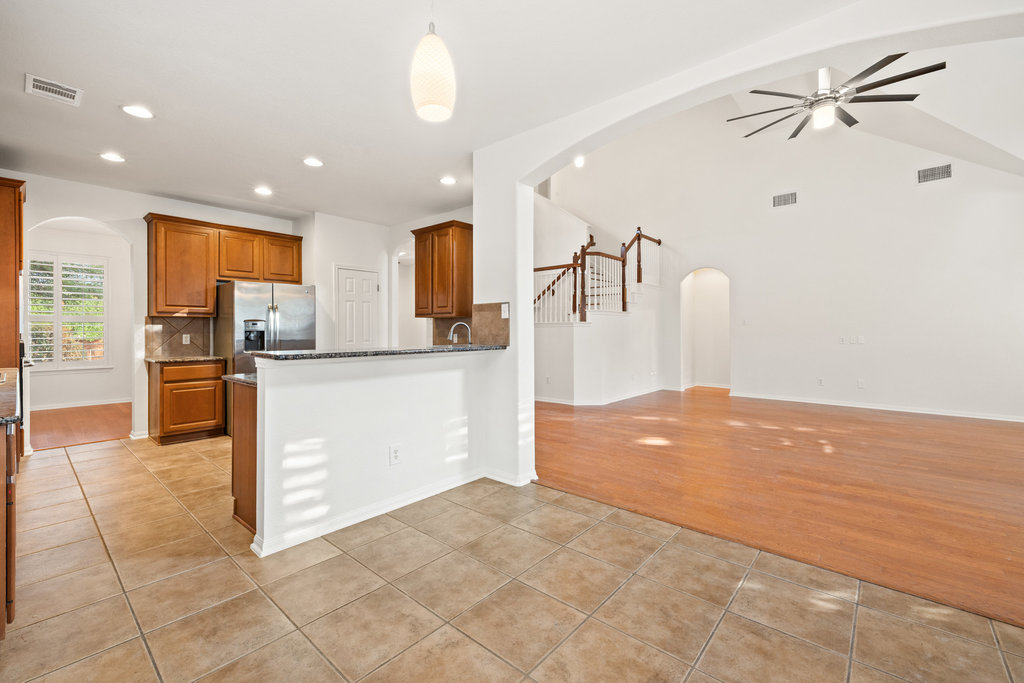 908 Golden Palomino Court Austin, TX 78732 - Photo 14 of 40 a view of kitchen with stainless steel appliances a refrigerator and microwave