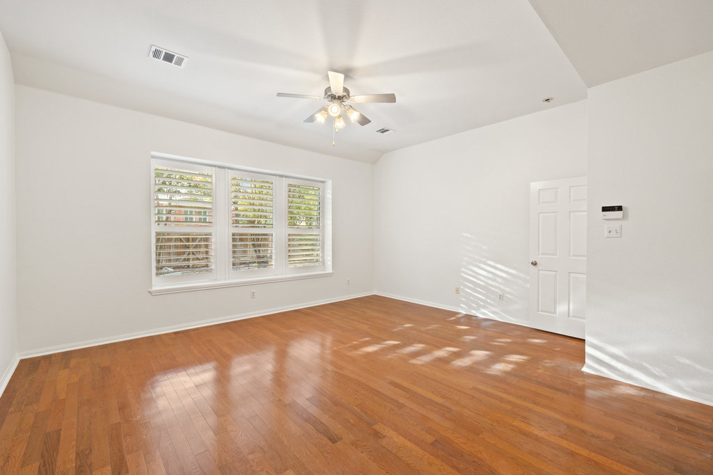 908 Golden Palomino Court Austin, TX 78732 - Photo 19 of 40 a view of an empty room with a window