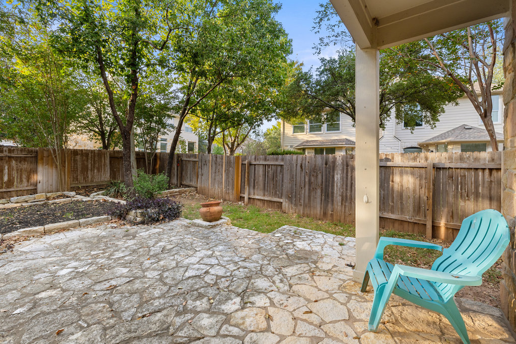 908 Golden Palomino Court Austin, TX 78732 - Photo 36 of 40 a view of backyard with green space and seating area