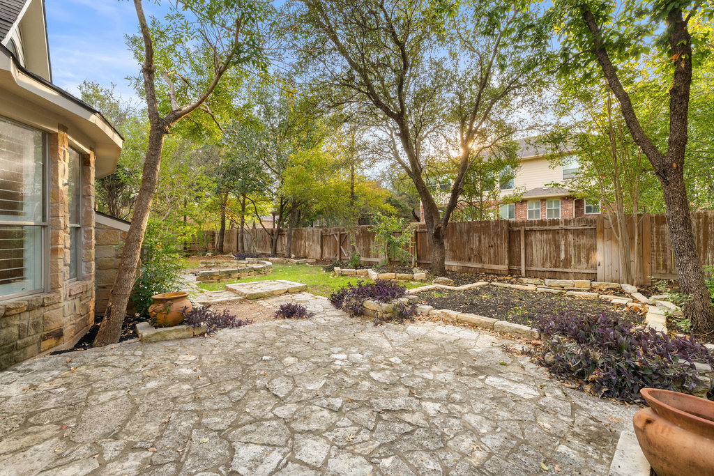 908 Golden Palomino Court Austin, TX 78732 - Photo 38 of 40 a view of a yard with a large tree