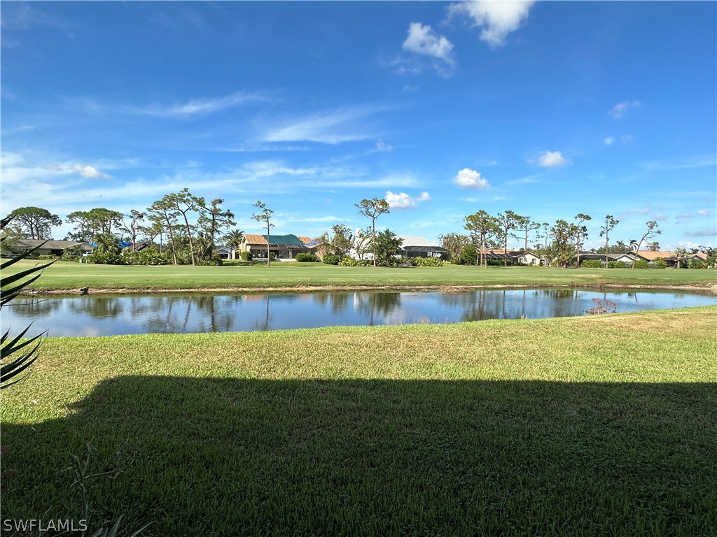 16680 Partridge Place Road, Unit 102 Fort Myers, FL 33908 - Photo 10 of 10 a view of a lake with houses in the background