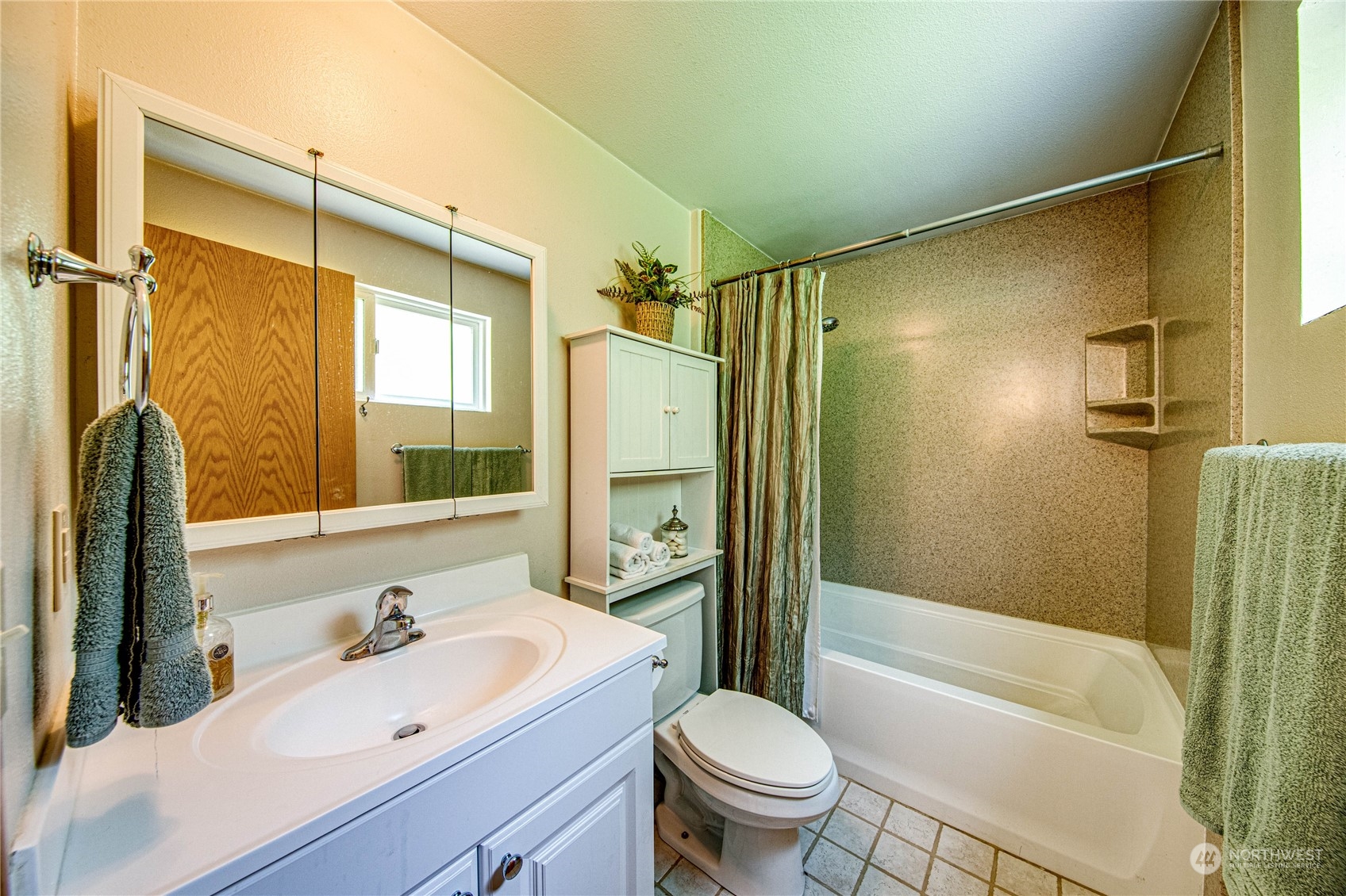 17129 North Road Bothell, WA 98012 - Photo 11 of 40 a bathroom with a sink toilet tub and shower