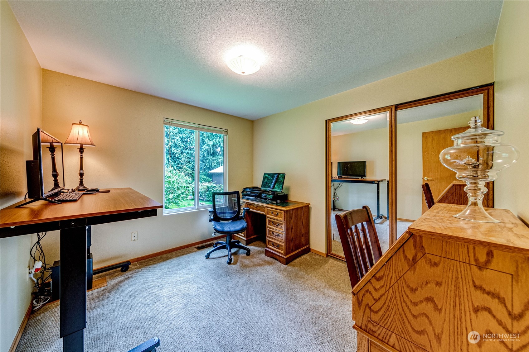 17129 North Road Bothell, WA 98012 - Photo 14 of 40 a view of a workspace with furniture and a window
