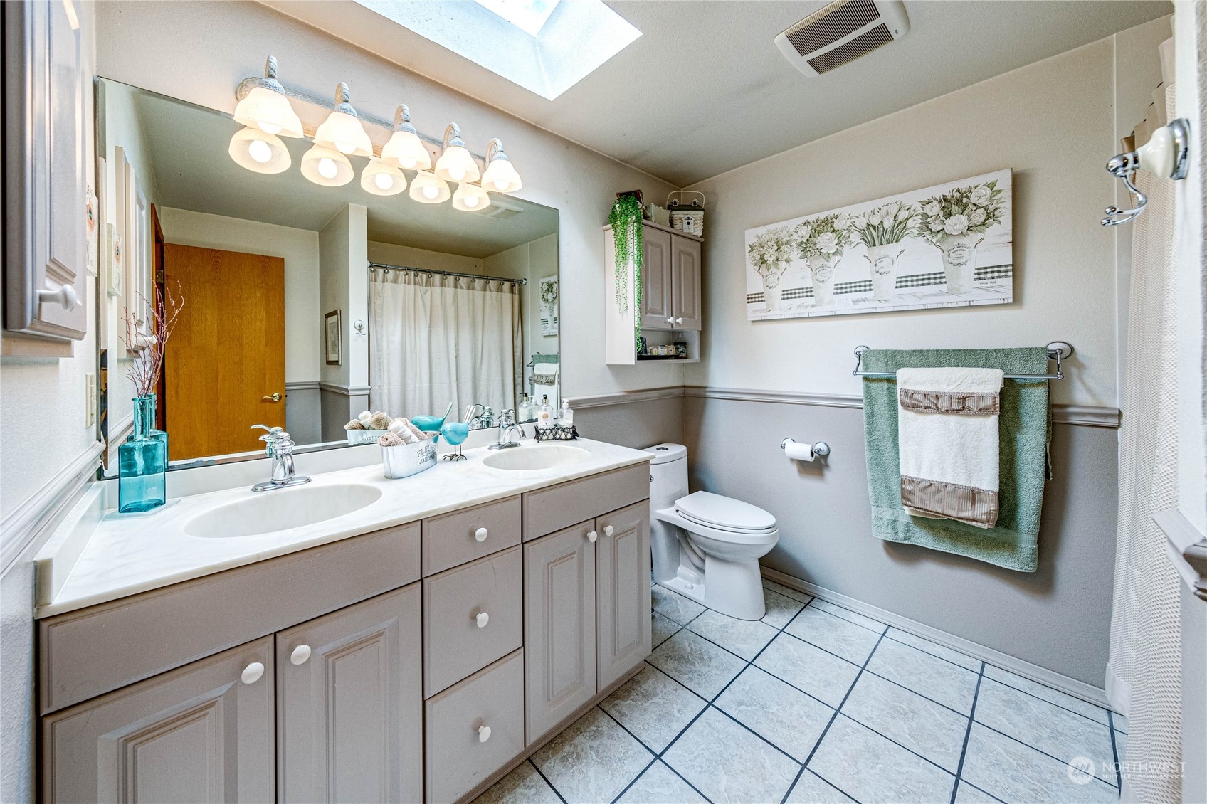 17129 North Road Bothell, WA 98012 - Photo 15 of 40 a bathroom with a toilet sink and mirror