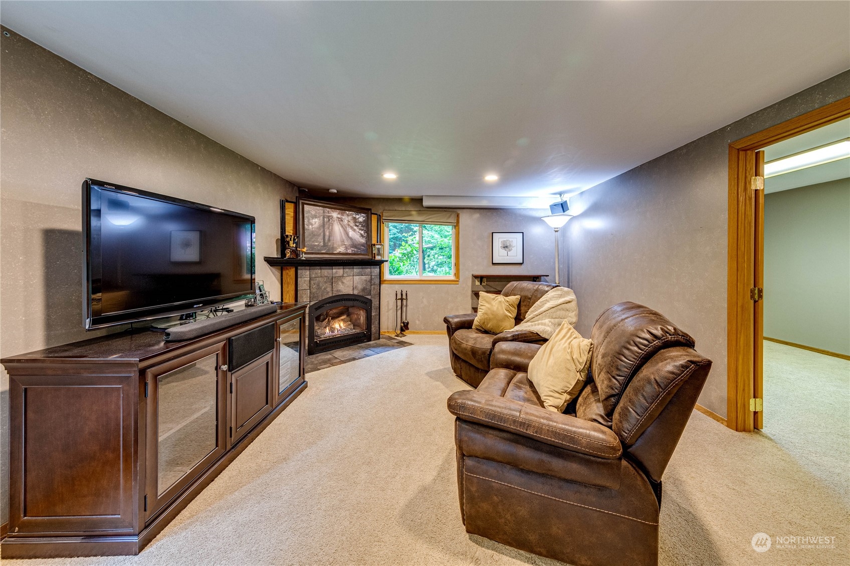 17129 North Road Bothell, WA 98012 - Photo 16 of 40 a living room with furniture and a flat screen tv