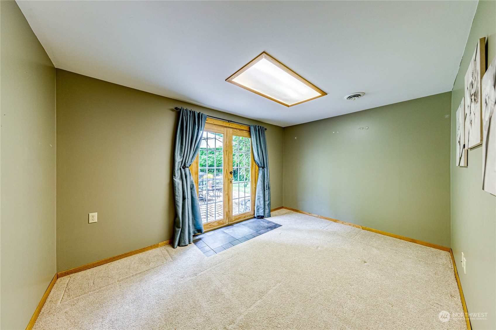 17129 North Road Bothell, WA 98012 - Photo 19 of 40 a view of a livingroom with a bed and a window