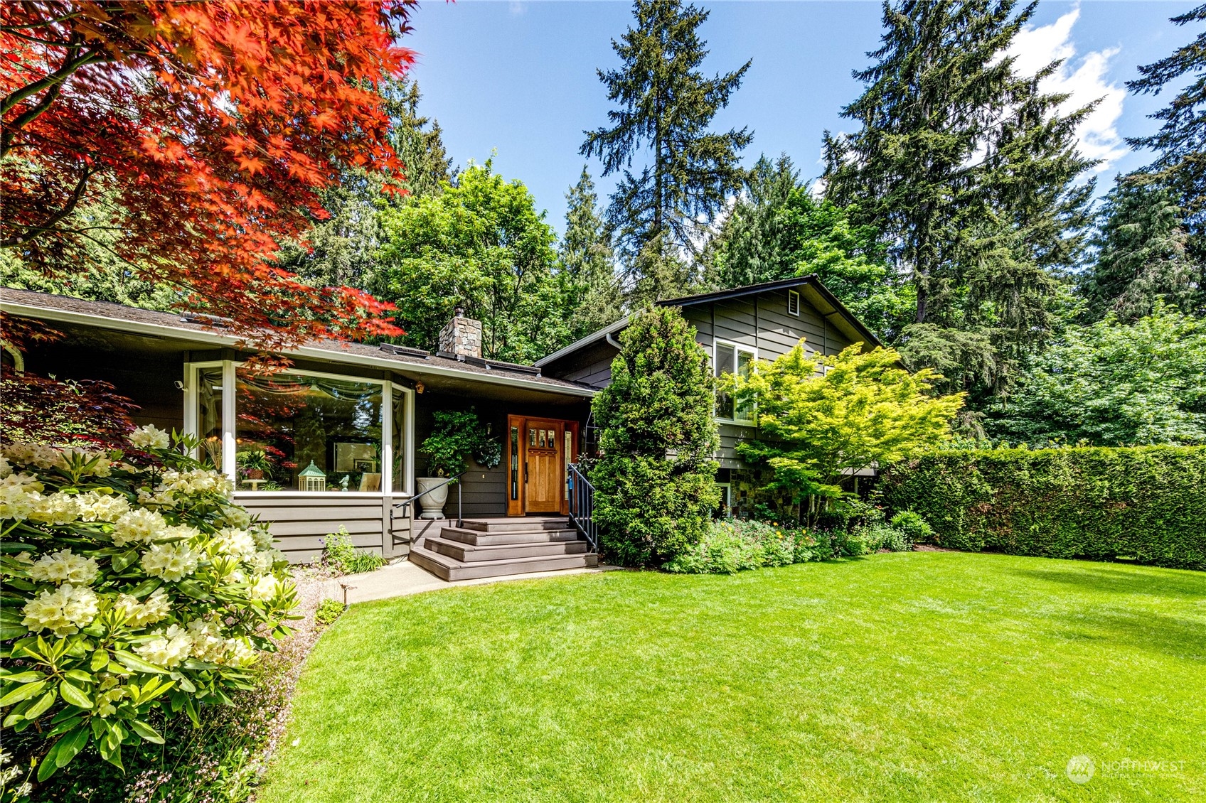 17129 North Road Bothell, WA 98012 - Photo 2 of 40 a house view with swimming pool and garden space