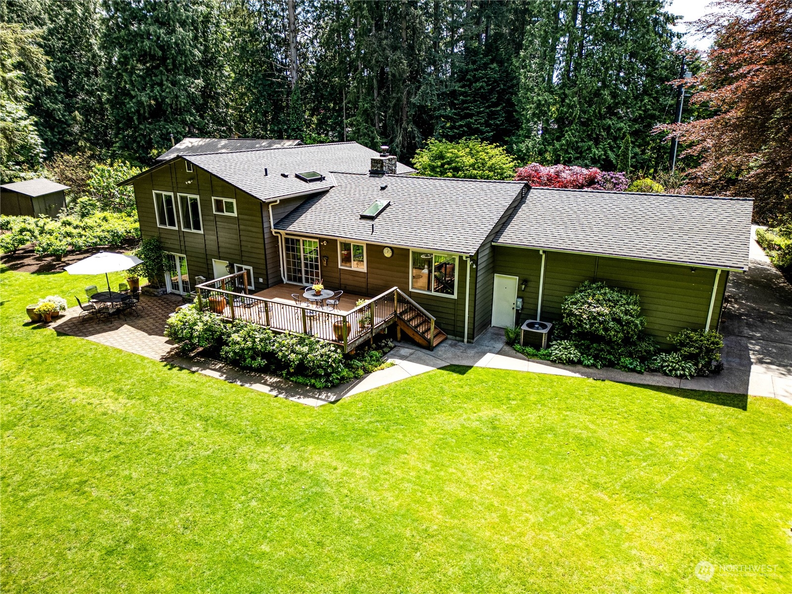 17129 North Road Bothell, WA 98012 - Photo 22 of 40 a view of a house with swimming pool and sitting area