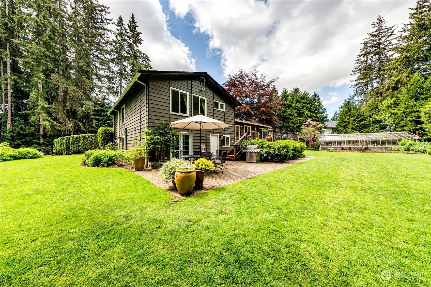 17129 North Road Bothell, WA 98012 - Photo 24 of 40 a front view of a house with yard and green space