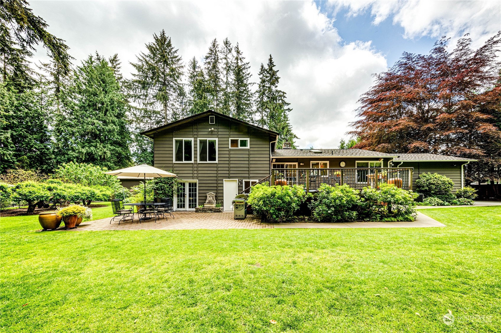17129 North Road Bothell, WA 98012 - Photo 26 of 40 a front view of a house with garden