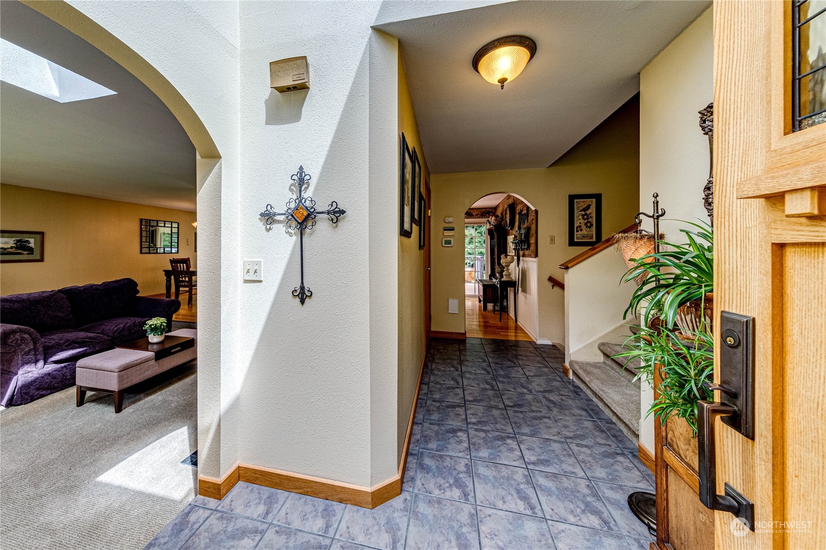 17129 North Road Bothell, WA 98012 - Photo 3 of 40 a view of a livingroom with furniture and a hallway