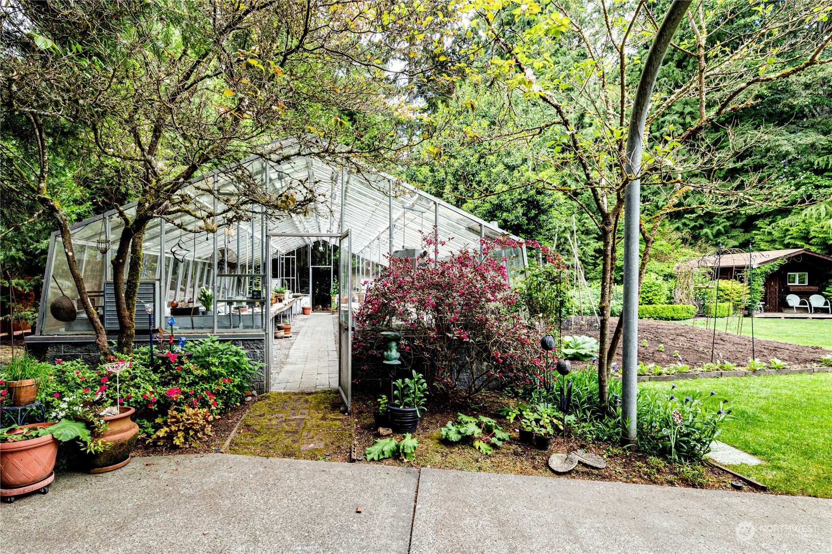 17129 North Road Bothell, WA 98012 - Photo 31 of 40 a view of a garden with patio