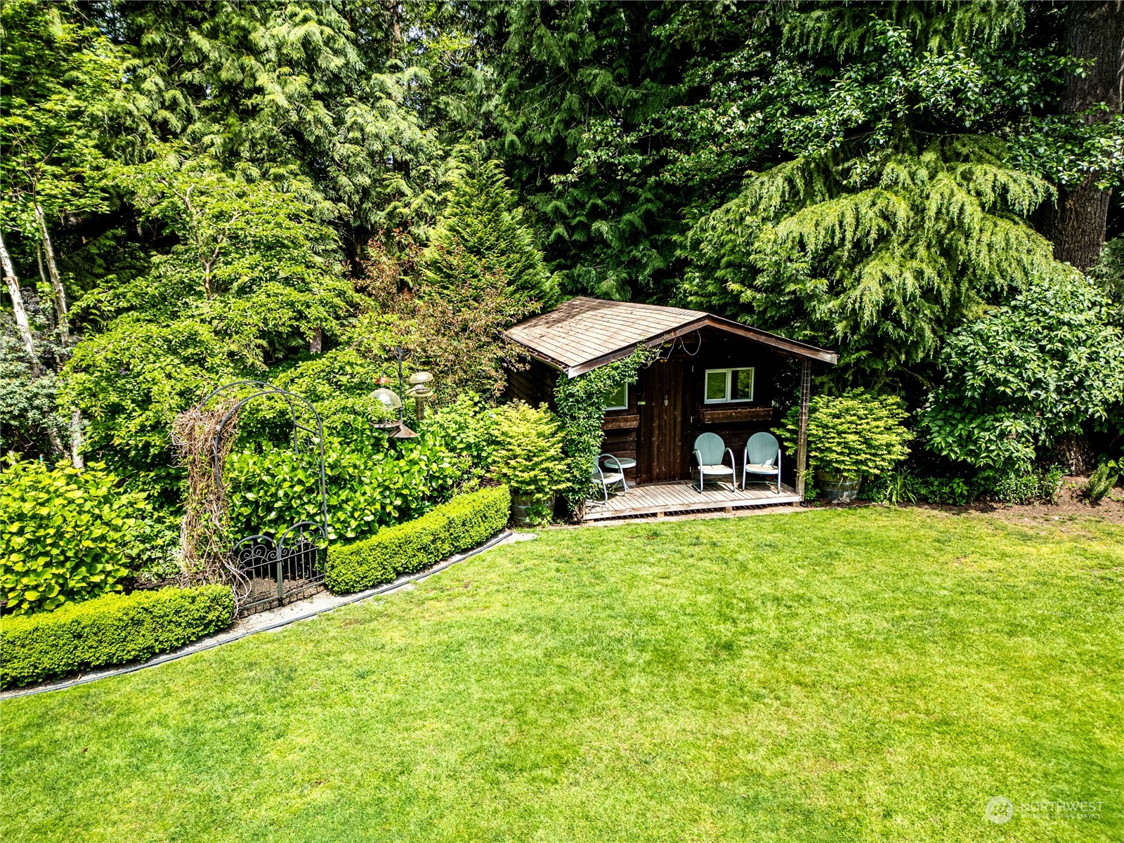 17129 North Road Bothell, WA 98012 - Photo 35 of 40 a view of a bench in the garden of a house
