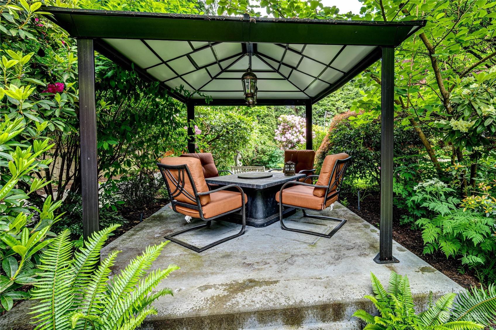 17129 North Road Bothell, WA 98012 - Photo 37 of 40 a backyard of a house with table and chairs
