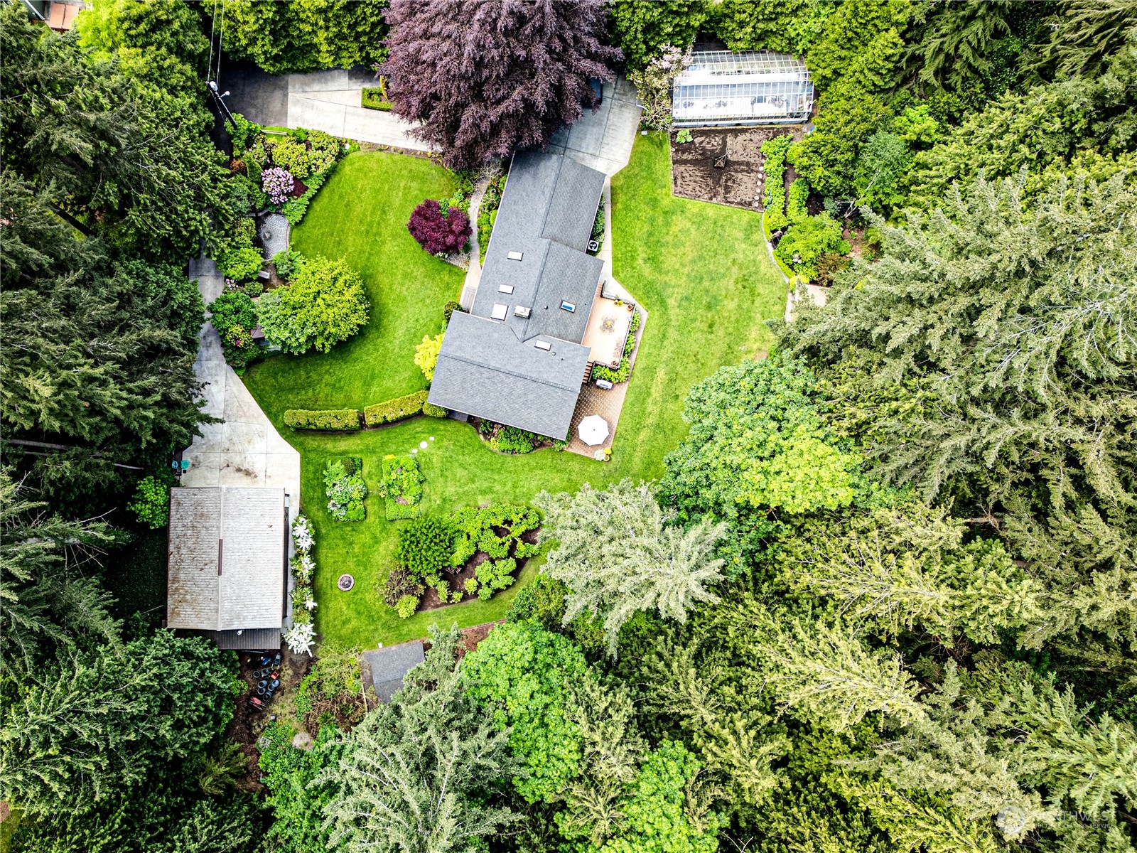 17129 North Road Bothell, WA 98012 - Photo 39 of 40 an aerial view of a house with a yard swimming pool outdoor seating and yard
