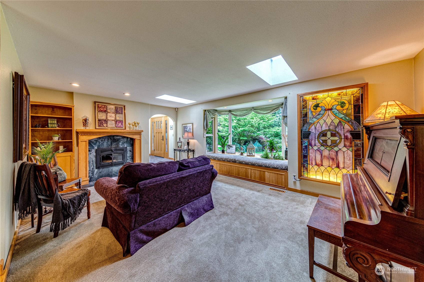 17129 North Road Bothell, WA 98012 - Photo 4 of 40 a living room with furniture and a flat screen tv