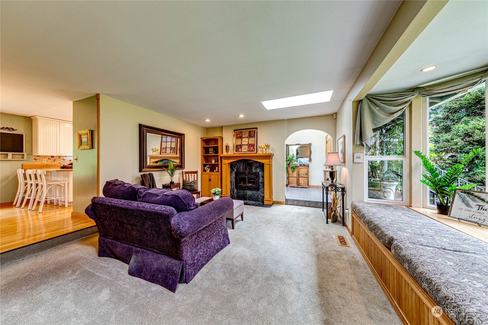17129 North Road Bothell, WA 98012 - Photo 5 of 40 a living room with furniture and a fireplace