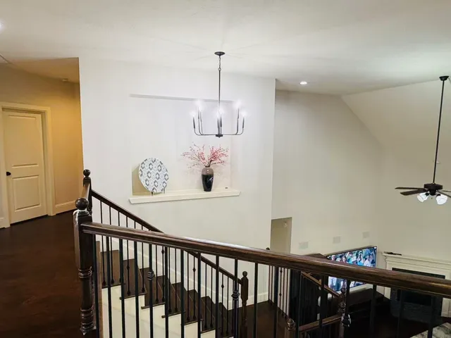 a view of a hallway with seating area