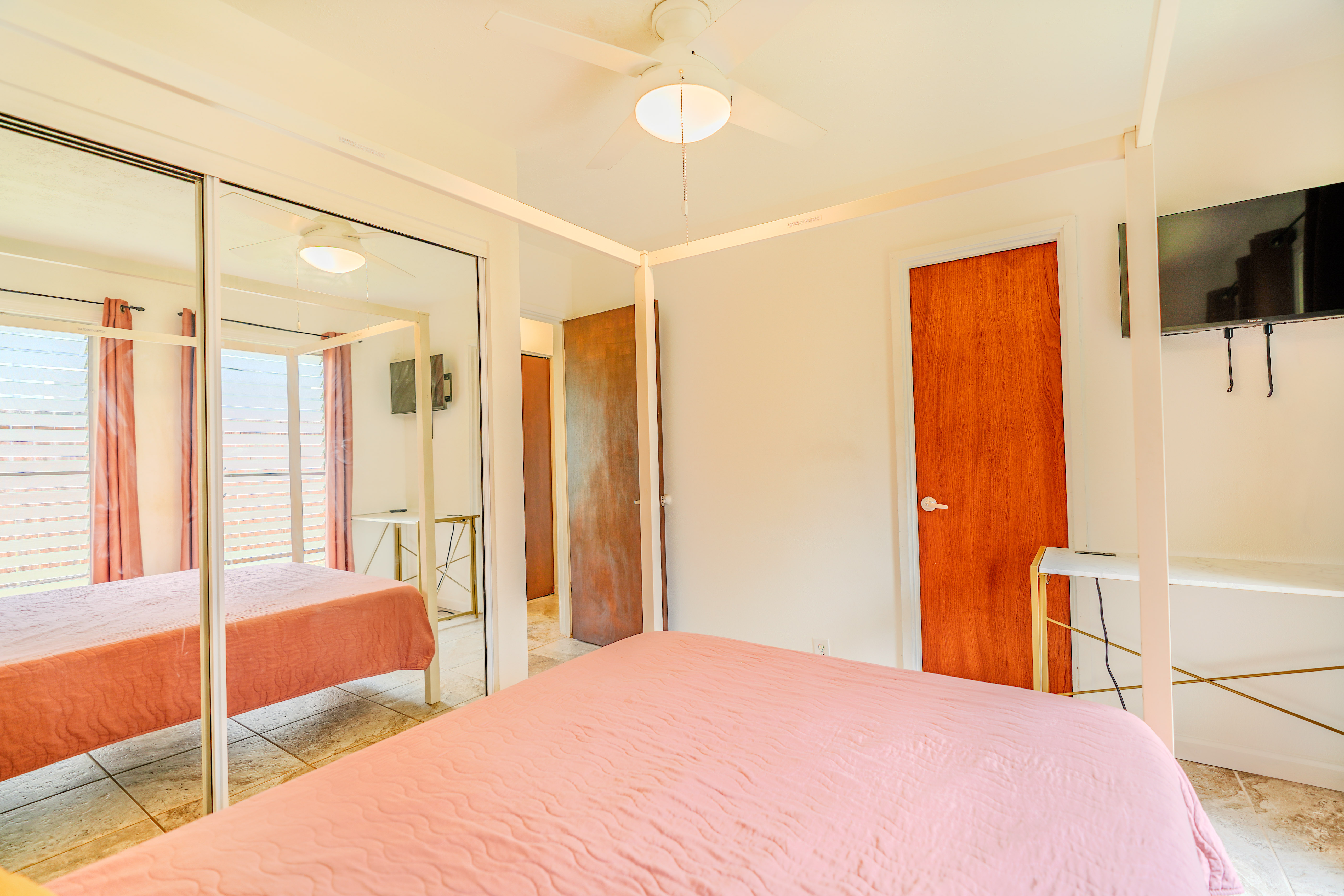 316 A Makani Road, Unit A Kapaa, HI 96746 - Photo 17 of 29 a bedroom with a bed window and walk in closet