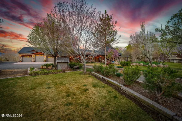 a view of a patio with table and chairs and potted plants