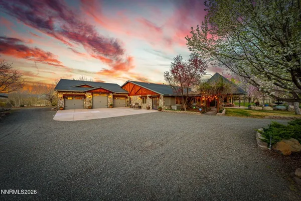 a view of a patio with a table and chairs