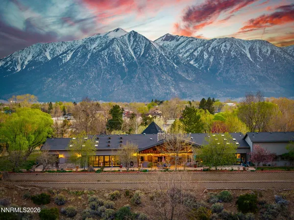 a view of a swimming pool with seating space